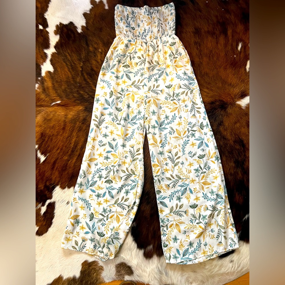 Medium white floral jumpsuit in excellent condition.